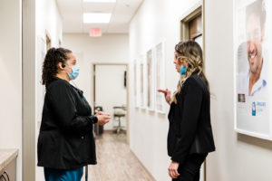 staff members talking in hallway