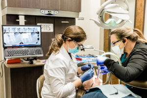Dr. Bright performing procedure
