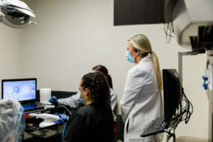 Dr. Little reviewing scans