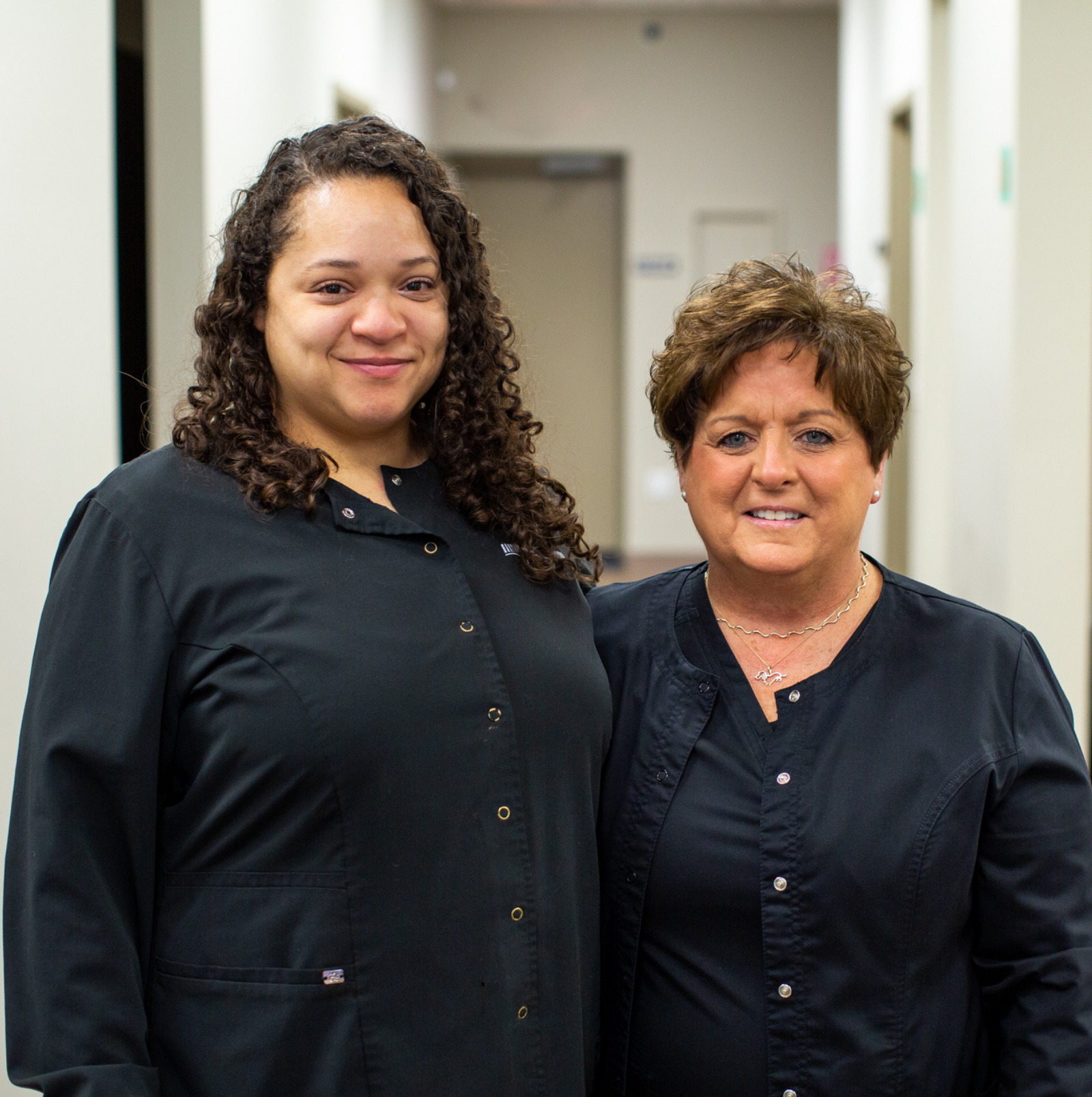 Two Staff Members